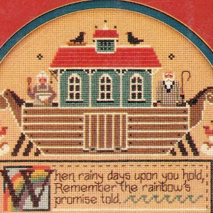 May include: Cross-stitch depiction of Noah's Ark, featuring a red-roofed structure with green walls and windows, flanked by two birds. The ark is filled with animals and people. The text reads, "Then rainy days upon you hold, Remember the rainbow's promise told."