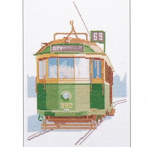 May include: Cross-stitch of a green and brown tram with the text "CITY RUSSELL ST" and the number "69" displayed. The tram is on tracks, with a light blue background. The number "392" is also visible.