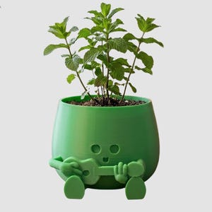 Puede incluir: Un juego de tres tazas de cerámica con un acabado moteado y mate. Las tazas son de color crema, gris claro y gris oscuro. Cada taza tiene un diseño simple y minimalista y un asa redondeada.