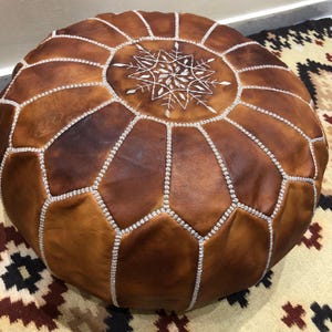 Unstuffed leather pouf ready for filling.