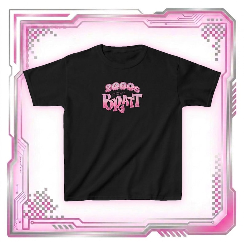 May include: Black t-shirt with the text "2000s Bratz" in a pink gradient font. The shirt has a crew neck and short sleeves. The design is centered on the front of the shirt. The shirt is displayed on a white background.