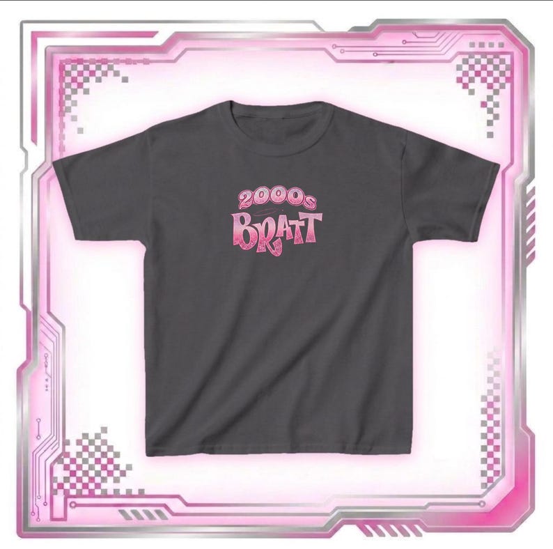 May include: Dark gray t-shirt with the text "2000s Bratt" in a pink gradient font. The shirt has a crew neck and short sleeves. The design is centered on the chest.