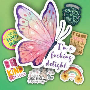 May include: A collection of colorful stickers with various designs and text. The central sticker features a watercolor butterfly with pink and purple wings. Other stickers include phrases like "I'm a fucking delight" and "Be kind of a bitch."
