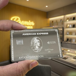 Luxury mirror American Express metal card with ultra reflective finish, precision laser engraving, premium metallic shine, and elegant custom detailing for a bold luxury wallet appearance.