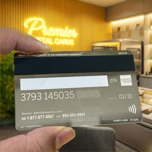 Premium mirror Amex style metal card featuring polished reflective surface, engraved personalization, sleek metallic texture, and sophisticated luxury craftsmanship designed for an elite look.