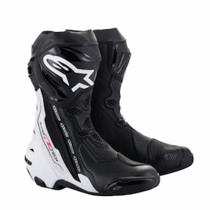 May include: Pair of black and white motorcycle boots. The boots feature a prominent white logo and accents, with the words "SUPERTECH" visible. The boots are designed for protection and performance, with a sleek, aerodynamic design.