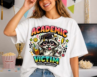 Academic Victim Raccoon Graduation Shirt, Funny Graduate Tee, Somehow Graduated Shirt, Chaotic Grad Gift, Class of 2026 Tee