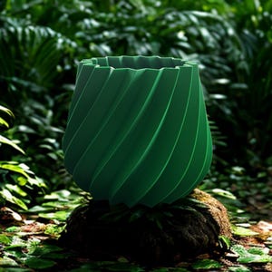 May include: A green, spiral-patterned planter sits on a mossy rock in a lush, green environment. The planter has a unique, textured design and is surrounded by dense foliage, creating a natural, organic aesthetic.