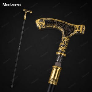 May include: A decorative walking cane in black and gold. The T-shaped handle is adorned with gold filigree and a crest. The black shaft contrasts with the gold accents. The cane is a stylish accessory, suitable for collectors or as a fashion statement.