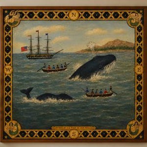 May include: A square framed painting depicting a maritime scene with a large dark whale breaching the water, a sailing ship, and two small rowboats with figures. The border features a compass design with N, E, S, W and mermaid illustrations.