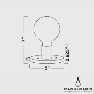 May include: Line drawing of a light fixture with a round bulb. The fixture is 7 inches tall, 5 inches wide, and 2.625 inches deep. The base is round with three screw holes. The text "PEARED CREATION - BRING THE PAST TO LIGHT" is at the bottom.