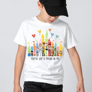 May include: A white ceramic mug with a black handle and the text "But First, Coffee" in a handwritten style. The mug is on a white surface. The mug is approximately 4 inches tall.