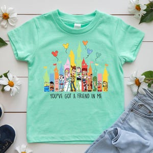 May include: A set of three ceramic mugs with a speckled, matte finish. The mugs are in shades of blue, green, and white. Each mug has a simple, modern design, perfect for coffee or tea. The mugs are stacked on top of each other.