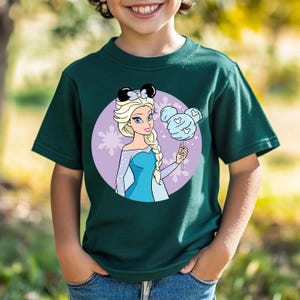 May include: A white ceramic mug with a black handle and the text "But First, Coffee" in a black, bold font. The mug is sitting on a wooden surface.