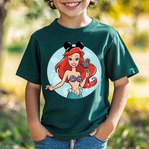 May include: A white ceramic mug with a black handle and the text "But First, Coffee" in a black, bold font. The mug is on a white surface. The mug is approximately 4 inches tall.