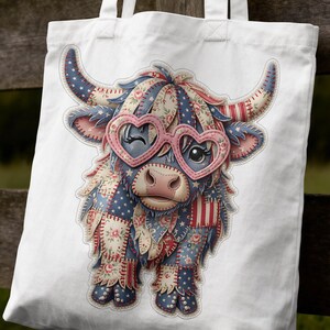 May include: White tote bag with a patchwork Highland cow design. The cow wears heart-shaped glasses and has floral, star, and striped patterns in red, white, and blue. Ideal for carrying groceries or personal items, this bag is a charming accessory.
