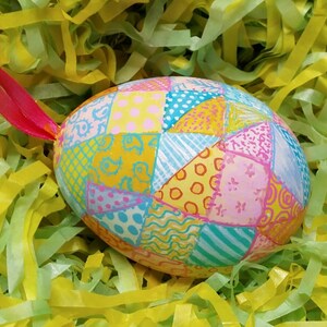 Patchwork Easter Egg ornament, with tiny fabric patterns, painted on a real eggshell.