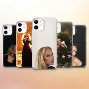 May include: A collection of phone cases featuring images of the singer Adele. The cases display various photos of Adele, including performance shots and portraits. The cases are designed to fit smartphones.
