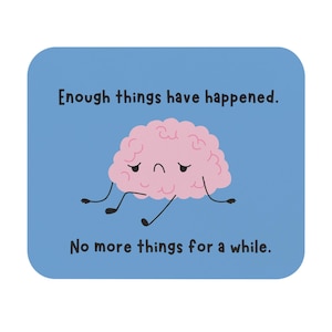 Może przedstawiać: Niebieski kwadratowy podkładka z tekstem "Enough things have happened. No more things for a while." Różowa postać mózgu ze smutnym wyrazem twarzy znajduje się na środku.