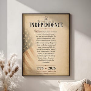 May include: A framed print of the Declaration of Independence, featuring the text in a vintage style with an American flag design. The print commemorates 250 years of freedom, with the years 1776 and 2026 displayed prominently. The print is displayed in a room with a window.