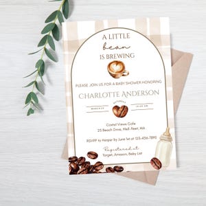 May include: A rectangular baby shower invitation card with a beige and white plaid background. The text reads A LITTLE bean IS BREWING, PLEASE JOIN US FOR A BABY SHOWER HONORING CHARLOTTE ANDERSON, with coffee cup, bean, and bottle graphics.