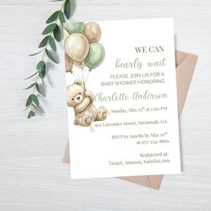 May include: Baby shower invitation featuring a watercolor illustration of a teddy bear holding balloons in shades of beige and green. The invitation text reads "We can bearly wait" and includes event details for Charlotte Anderson.