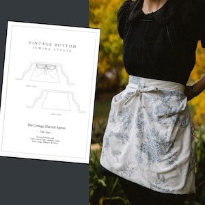 May include: A white and blue patterned apron tied at the waist, with a matching tie. The apron is worn over a black top. A sewing pattern for "The Cottage Harvest Apron" is visible on the left, with the text "Vintage Button Sewing Studio".