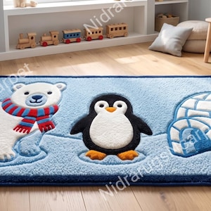 May include: A rectangular area rug featuring a light blue background with a white polar bear wearing a red and blue striped scarf, a black and white penguin, and a white igloo with blue outlines. The rug has a dark blue border trim.