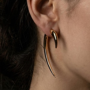 May include: A rustic wooden sign with the text "Welcome to our home" in white lettering. The sign features a distressed finish and a simple, inviting design, perfect for entryway decor.