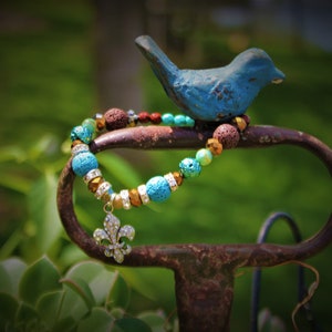 Pulseira flor de lis com óleo essencial