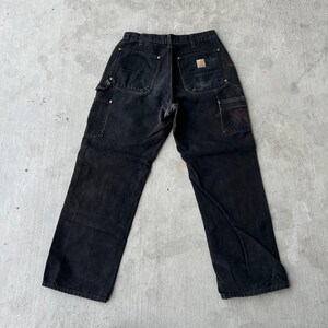 Pantalones de carpintero de trabajo Carhartt de color negro descolorido con doble rodilla imagen 4