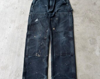 Pantalones de trabajo Carhartt negros desgastados con doble rodilla, talla 32x32.