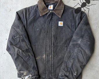 Chaqueta de trabajo Carhartt negra desteñida para climas árticos, talla grande.
