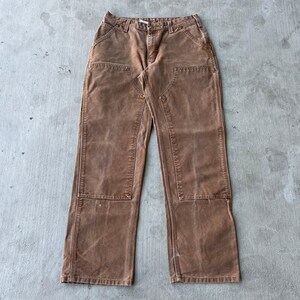 Pantalones de carpintero Carhartt marrones con doble rodilla para mujer imagen 1