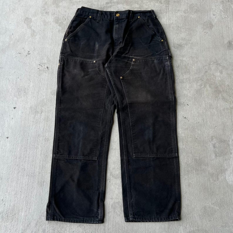 Pantalones de carpintero de trabajo Carhartt de color negro descolorido con doble rodilla imagen 1