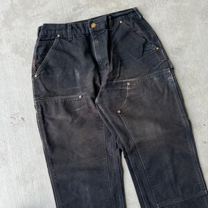 Pantalones de carpintero de trabajo Carhartt de color negro descolorido con doble rodilla imagen 2