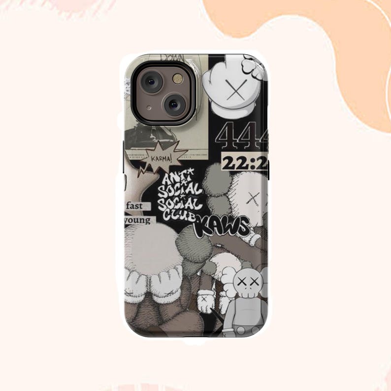 May include: A phone case with a collage design, including the text "ANTI SOCIAL SOCIAL CLUB" and "KAWS". The case has a black and white colour scheme with various graphic elements, such as a hand with an "X" and the numbers "44" and "22:2".
