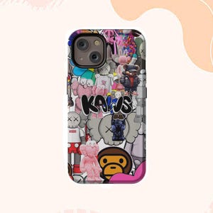 May include: A phone case with a vibrant collage of cartoon characters and the word "KAWS" in black. The case has a glossy finish and a camera cutout. The design includes various characters in different poses and colours.