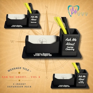 May include: A black desk organizer set featuring a business card holder and a pen cup. The pen cup displays white text reading Ask Me About Dentures, Dental Cleaning, or Tooth Bonding. Each unit holds a white business card with the logo UR Union Ridge.