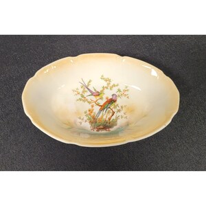 May include: A handmade, wooden serving tray with a natural finish. The tray features a rectangular shape with raised edges and two handles. The wood grain is visible, adding to its rustic charm. Dimensions are approximately 16 inches long and 10 inches wide.
