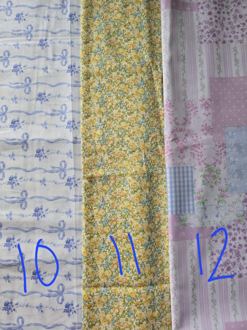 May include: Three fabric swatches with different patterns. The first is white with blue ribbons and floral accents. The second is yellow with a small floral pattern. The third is a patchwork design with pink, blue, and white floral and gingham patterns.