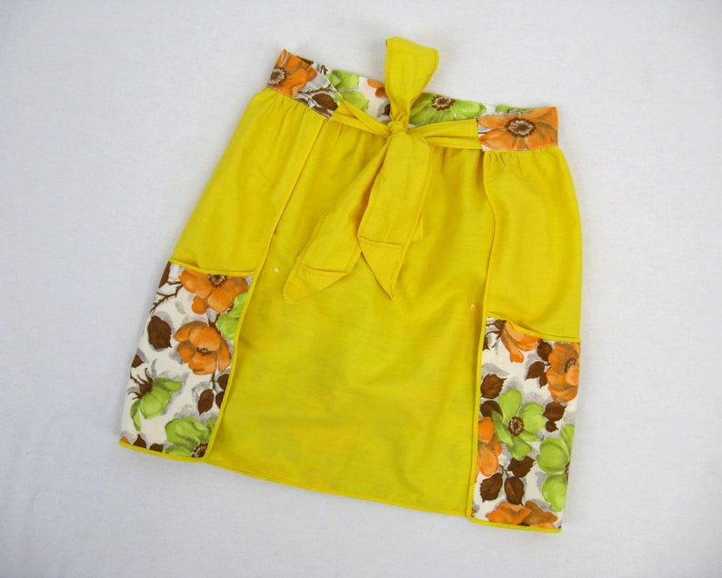 Black floral and yellow 1960s vintage dress apron