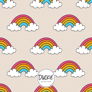 May include: A repeating pattern on a light beige grid background featuring colourful rainbows with pink, orange, yellow, and blue stripes, each resting on white clouds. A circular white logo with the text DUCKIE DESIGN STUDIO is centred.