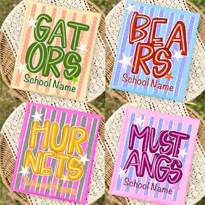 May include: Four rectangular signs featuring vertical stripes and white star accents. The signs display the text GATORS, BEARS, HORNETS, and MUSTANGS in large, colourful, bubble-style lettering, with the words School Name printed below each.
