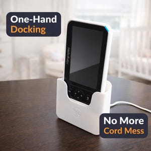 May include: A white ceramic mug with a black handle and the text "But First, Coffee" in a bold, black font. The mug is filled with a dark liquid, likely coffee, and sits on a light-colored surface.