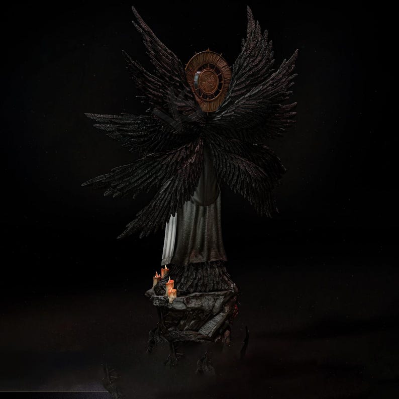 May include: A dark-toned figurine of a winged entity with multiple black feathered wings and a circular bronze-colored halo behind its head. The figure stands on a rocky base adorned with small, lit orange candles, set against a black background.