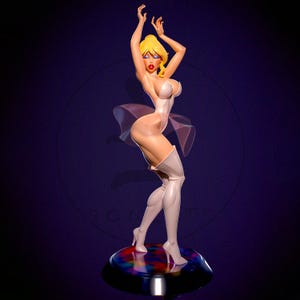 May include: A stylized figurine of a woman with blonde hair, red lips, and blue eye shadow, wearing a white bodysuit and thigh-high boots. The figure is posed with arms raised, standing on a colorful, circular base.