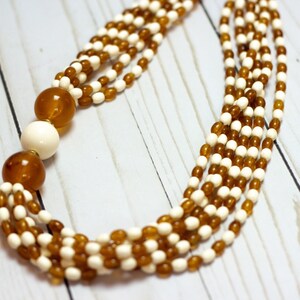 Avon *SIGNED* Vintage Amber-tone // Rust Orange // Cream White Acrylic 6-strand Beaded Necklace / 22in L / Asymmetrical / 70s & 80s Vibe