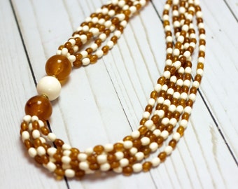 Avon *SIGNED* Vintage Amber-tone // Rust Orange // Cream White Acrylic 6-strand Beaded Necklace / 22in L / Asymmetrical / 70s & 80s Vibe