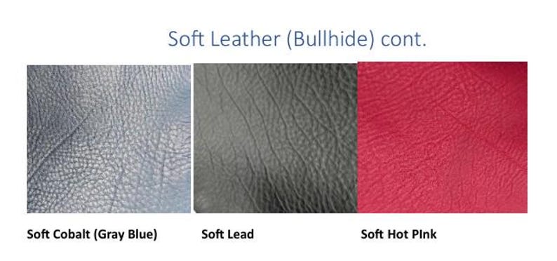 May include: Three swatches of soft bullhide leather displayed side by side. The colors are labeled as Soft Cobalt (Gray Blue), Soft Lead, and Soft Hot Pink. The text at the top reads Soft Leather (Bullhide) cont. Each swatch shows a textured surface.
